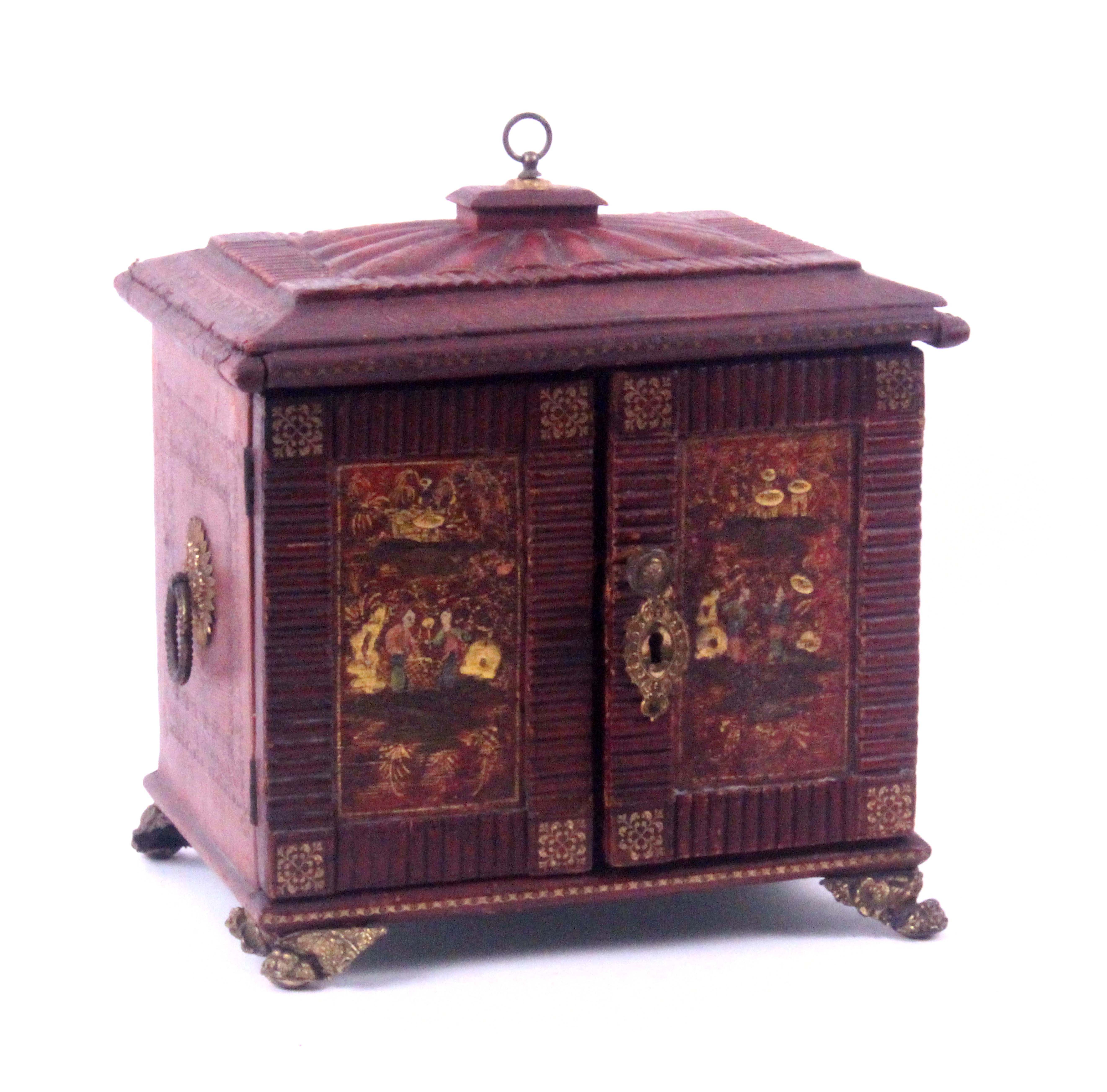 A Regency red leather and tooled table cabinet, circa 1800, the fan segmented top within fluted