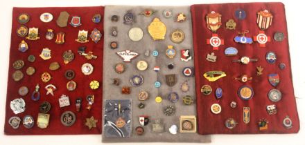 Enamel lapel badges, brooches and medals, comprising three displays totalling sixty examples, and