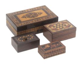 Four small Tunbridge ware rectangular boxes, comprising a rosewood example, the sides in geometric