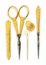 A set of five French gold sewing tools, comprising an attractive thimble, the frieze with entwined