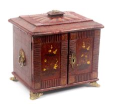 A Regency red leather covered jewellery/sewing and writing cabinet, with tooled and chinoiserie