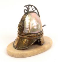 A watch stand in the style of Palais Royal fashioned as a classical helmet in mother of pearl and