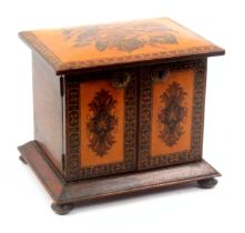 A Tunbridge ware rosewood table cabinet, on four bun feet below a canted rosewood moulding, the
