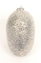 An attractive silver egg form etui, unmarked, the egg with all over floral decoration with a