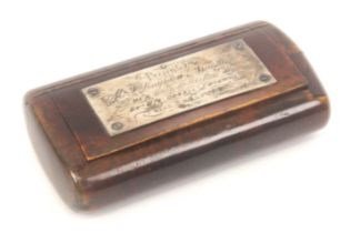 A burr wood snuff box of oval section, the lid with an engraved silver plaque 'Presented to Mr. F.