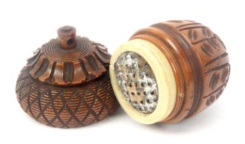 A coquilla nut acorn form nutmeg grater, with engine turned decoration, bone screw upstand with