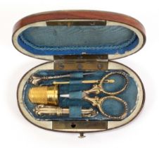 A miniature sewing set for a child or doll, probably Tahan, Paris, circa 1870, the oval kingwood