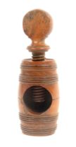 A late 18th, early 19th Century boxwood screw form nut cracker, the barrel form body with top screw,