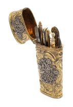 A late 18th Century gilded silver continental etui, of oval section and tapering form decorated with