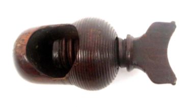 An early 19th Century screw form nut cracker, hardwood, acorn form body with top screw, 7.5cms.