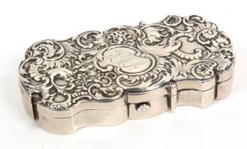 A fine silver etui/sewing companion by Thornhill, the case of shaped outline, the lid with leaf