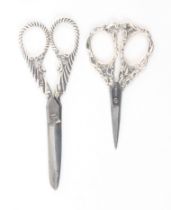 Two pairs of silver mounted scissors, comprising a pair, London 1890, makers mark indistinct,
