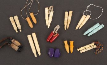 Twelve pairs of knitting needle protectors, comprising six bone pairs, a pair as trotters, two