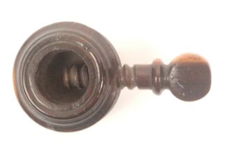 A late 18th/early 19th Century screw form hardwood nut cracker, roundel turned body below a top