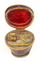 A charming miniature sewing set for a child or doll, contained in a tortoiseshell and gilt metal