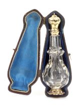A gold mounted glass perfume bottle in original leather case, mid 19th Century, Dutch, the