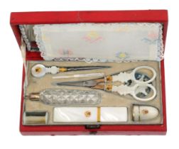 A fine Palais Royal sewing set contained in steel mounted red leather rectangular case, circa