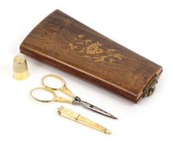 A French rosewood etui and a set of three French silver gilt sewing tools, the etui of tapering form