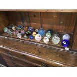 Twenty four various paperweights