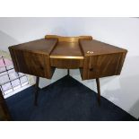 A teak corner dressing table