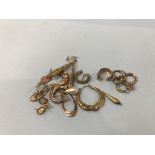 A quantity of gold coloured earrings