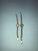 A ladies 9ct gold wristwatch and a ladies watch, with 9ct gold strap