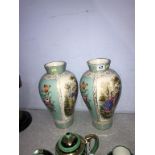 A pair of Continental porcelain decorative vases, 31cm height