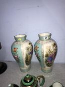 A pair of Continental porcelain decorative vases, 31cm height