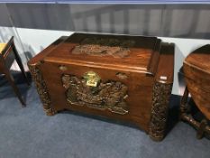 A carved Oriental chest, 100cm wide, 50cm deep, 58cm high