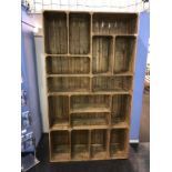 A shelving unit with sixteen compartments, 120cm wide, 36cm deep, 212cm height