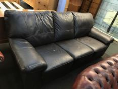 A brown leather settee