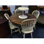A circular table and four stick back Windsor chairs