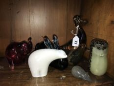 A collection of coloured glass animals