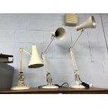 Three angle poise lamps