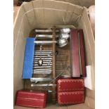 Assorted cutlery and two Cartier boxes