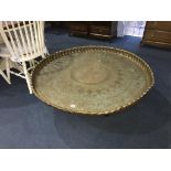 A very large Indian brass circular table, on metalwork stand, 115cm diameter