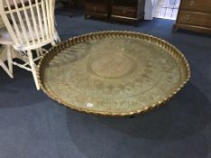 A very large Indian brass circular table, on metalwork stand, 115cm diameter