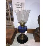An oil lamp, with blue reservoir
