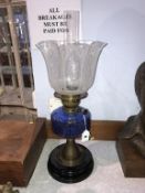 An oil lamp, with blue reservoir