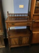 An Edwardian Gillows of Lancaster side cabinet, with single drawer and two cupboard doors below,