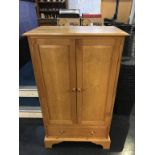 A Robinson -Gay oak cabinet (cost £1175), 79cm wide