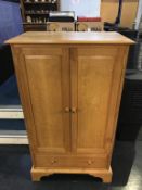 A Robinson -Gay oak cabinet (cost £1175), 79cm wide