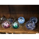 A collection of 17 Caithness and other Scottish paperweights