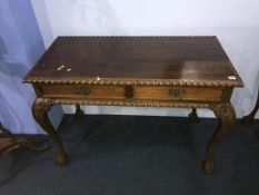 A reproduction mahogany two drawer side table