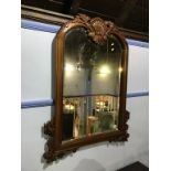 A reproduction mahogany wall mirror, 106 x 80cm