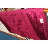 A maroon down filled quilt