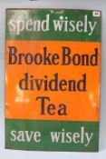 An enamel sign 'Brooke Bond Dividend Tea', 42 x 62cm