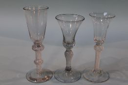Three various clear twist stem glasses