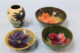 Three modern Moorcroft dishes and a small vase