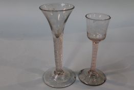 A Georgian opaque air twist glass, with bell shaped bowl and a plain air twist glass, with trumpet